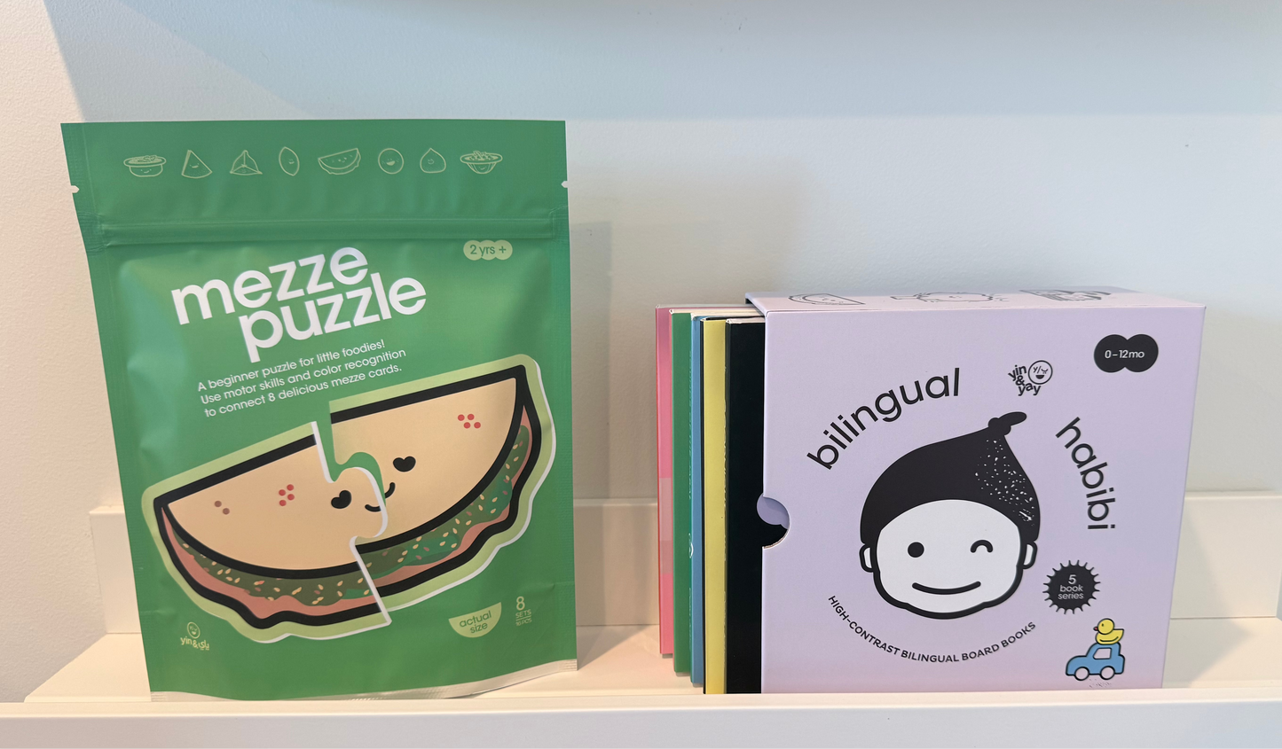 Shelf with 'mezze puzzle' and 'habibi' books