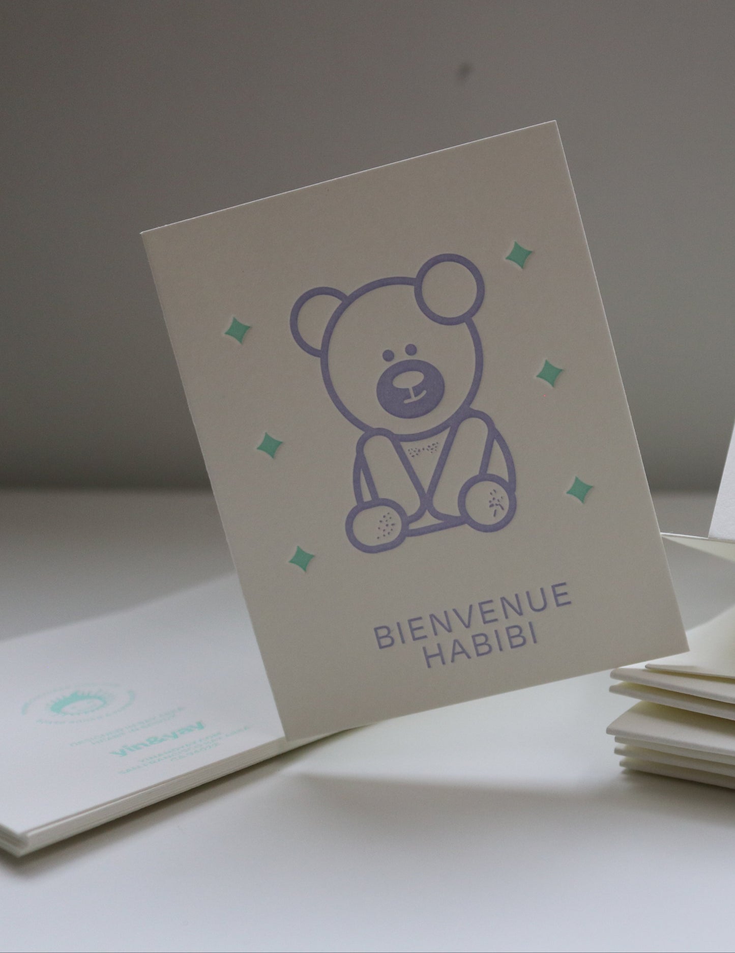 Set of greeting cards with a bear dabdoob design and text on a plain background
