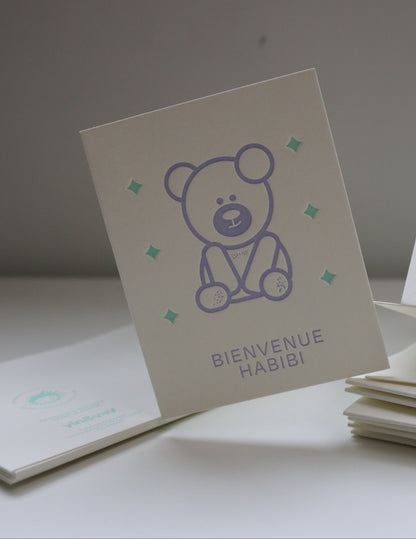 Set of greeting cards with a bear dabdoob design and text on a plain background