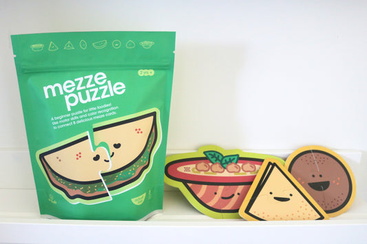 Mezze Puzzle stand up pouch packaging with puzzle pieces on a white background